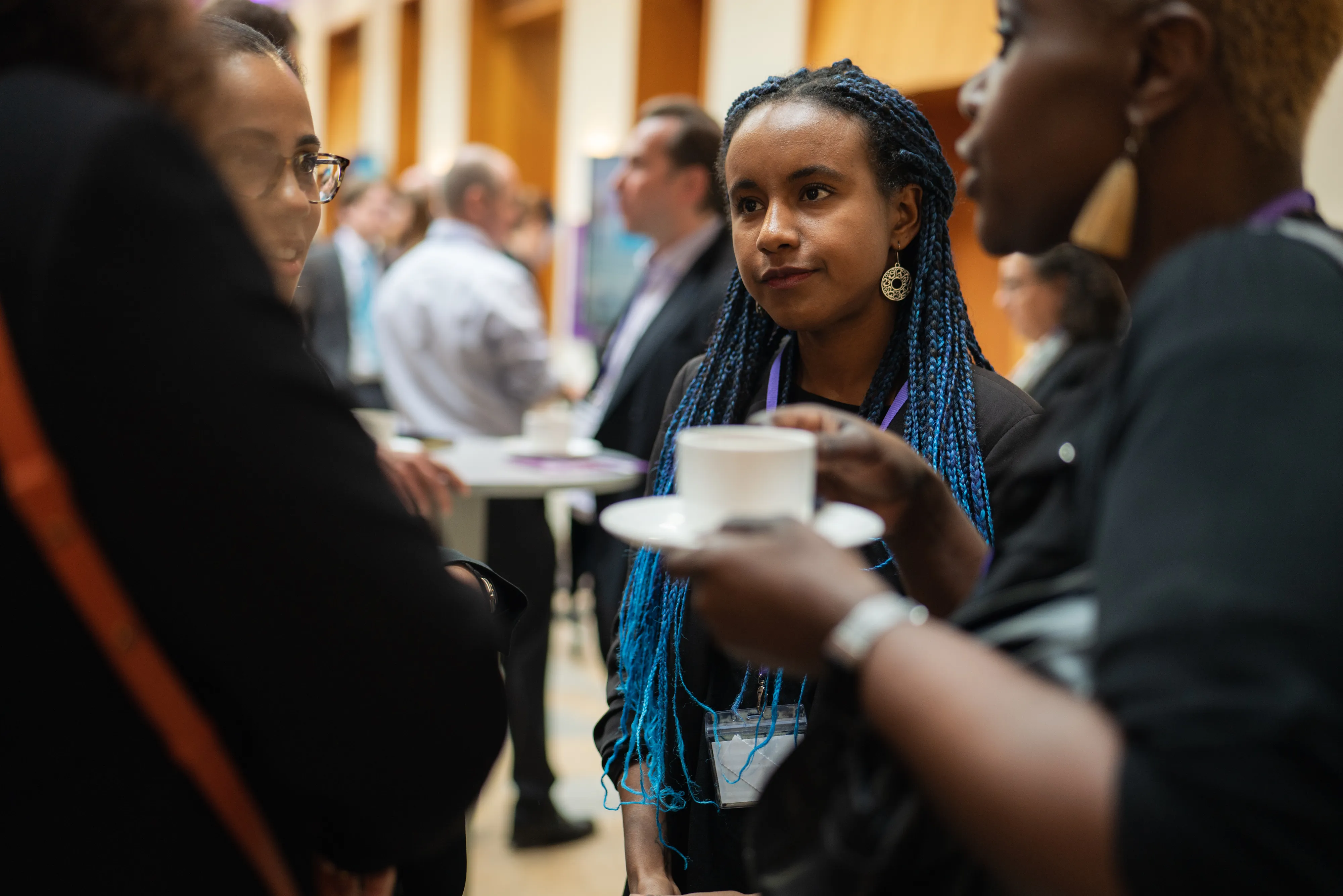 Young professionals networking at a London conference