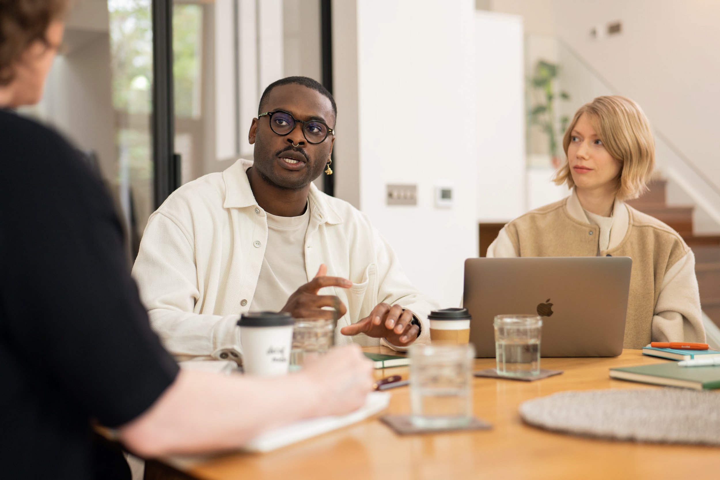Diverse team in discussion during a corporate branding photography shoot in London